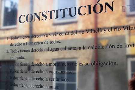VILNIUS, LITHUANIA - JULY 12, 2017: Constitution of Republic of Uzupis in Spanish language. Uzupis is a bohemic neighborhood in Vilnius, popular among artists and tourists.のeditorial素材