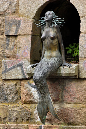 VILNIUS, LITHUANIA - JULY 12, 2017: Sculpture of mermaid in Republic of Uzupis. Uzupis is a bohemic neighborhood in Vilnius, popular among artists and tourists.のeditorial素材