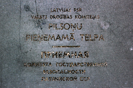 Riga, Latvia - July 10, 2017: Plaque on Former KGB office, now part of Museum of the Occupation of Latvia and popular tourist destination.のeditorial素材