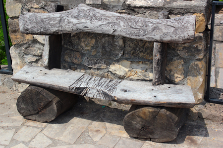 Wooden bench made of thick logsの写真素材