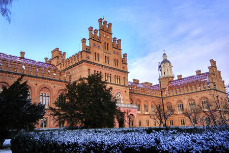Chernivtsi, Ukraine - December 21, 2017: Workers replace roof tiles on National University building, former residence of Bukovina Metropolitans, included in UNESCO World Heritage List.のeditorial素材