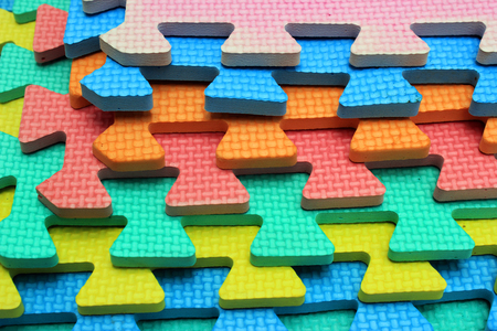 Plastic cutout children jigsaw puzzle pieces の写真素材