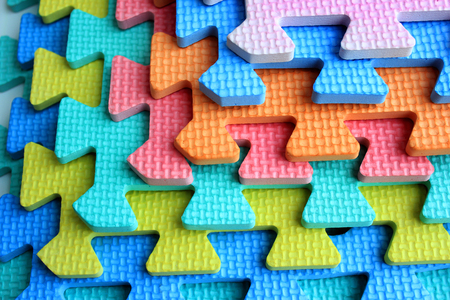 Plastic cutout children jigsaw puzzle pieces の写真素材