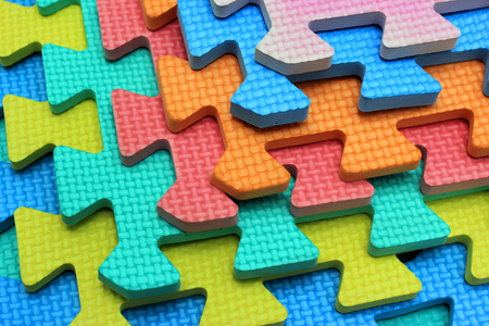Plastic cutout children jigsaw puzzle pieces の写真素材