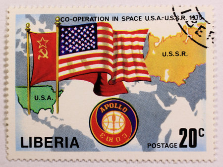KHARKIV,UKRAINE - MARCH 5,2018: Old post stamp of Liberia, depicting cooperation in space between USA and USSR.のeditorial素材