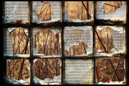 Broken glass blocks window in an abandoned building