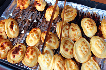 Traditional small Polish oscypek (fried sheep cheese) at street stall in Lublin, Polandの写真素材