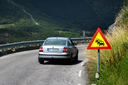 Ullensvang, Norway - June 22, 2018: Traffic jam ahead warning road sign on a narrow coastal road along the Hardanger fjord in Hordaland county, Norway.のeditorial素材