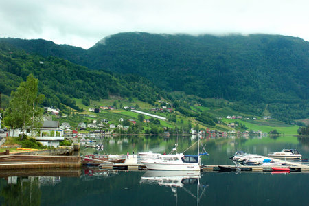 Ulvik, Norway - June 24, 2018: View of Ulvik village in Hordaland county, the popular resort at the end of Ulvikafjord, with coastal promenades and beautiful rural landscapes.のeditorial素材