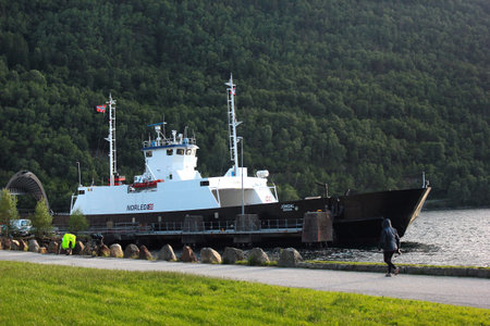 Kinsarvik, Norway - June 22, 2018: Ferry at Kinsarvik harbour, Hordaland county. Kinsarvik is famous by a picturesque natural scenery nearby and is a popular tourist destination.のeditorial素材