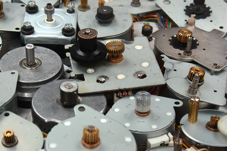 Pile of old stepper motors as industrial e-waste backgroundの写真素材