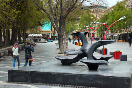 Baku, Azerbaijan - April 25, 2017: Square of Fountains, a popular place among locals and tourists in downtown Baku, the capital of Azerbaijan and major tourist destination.のeditorial素材