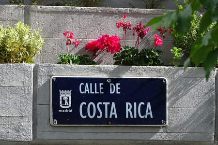 Madrid, Spain - May 13, 2017: Street of Costa Rica name plate, with the bear and the strawberry tree - the Madrid coat of arms.のeditorial素材
