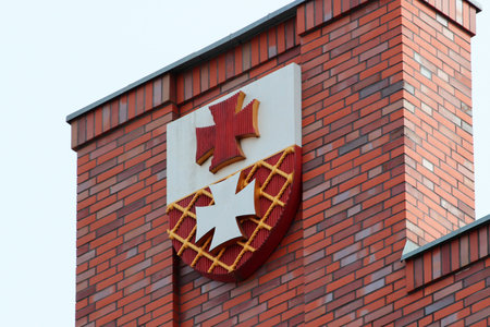 Elblag, Poland - May 9, 2019: Coat of arms of Elblag on the city hall building. The Old Town of Elblag was destroyed during WWII and is being restored since 1989 till now.のeditorial素材