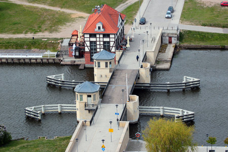 Elblag, Poland - May 9, 2019: High Bridge (Wysoki Most), a drawbridge over Elblag river near the historical Old Town of Elblag, destroyed during WWII and restored nowadays.のeditorial素材