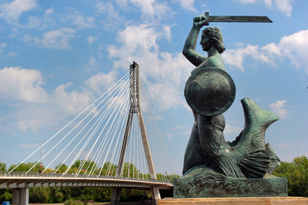 Warsaw, Poland - May 1, 2019: Mermaid (Syrenka) statue, the famous symbol of the city, on Vistula River embankment.のeditorial素材