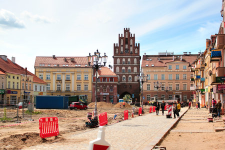 Bartoszyce, Poland - May 6, 2019: View of main Constitution square with Lidzbark Gate in the center...