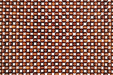 Wooden beads pattern, isolated against white backgroundの写真素材