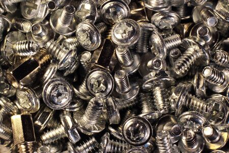Pile of shiny metal screws, closeup imageの写真素材