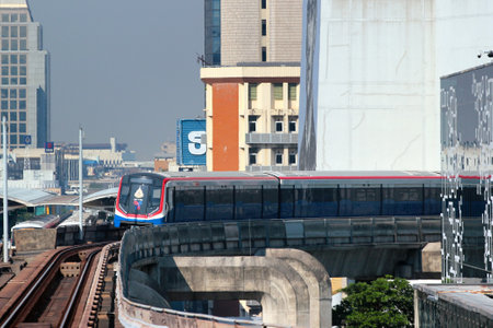 Bangkok, Thailand - December 11, 2019: BTS Skytrain approaching Siam station in central Bangkok. Bangkok Mass Transit System is an elevated rapid transit system in the capital of Thailand.のeditorial素材