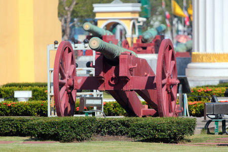 Bangkok, Thailand - December 10, 2019: An old cannon in front of the Ministry of Defence of Thailand in Bangkok, opposite Temple of the Emerald Buddha. It controls and manages the Royal Thai Armed Forces.のeditorial素材