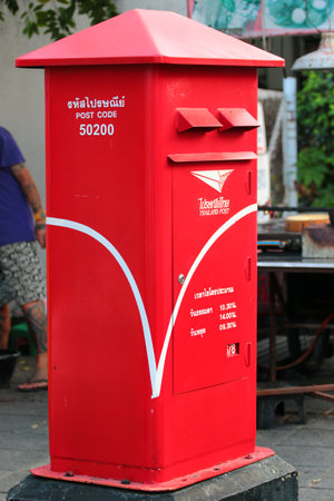 Chiang Mai, Thailand - December 3, 2019: Mailboxes of Thailand Post traditionally have red color.のeditorial素材