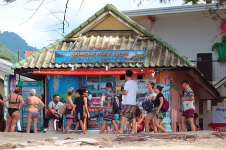 Phuket, Thailand - December 4, 2019: Tourists at the Kamala Beach, a popular place in Phuket island north of Patong city.のeditorial素材