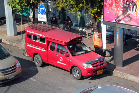 Chiang Mai, Thailand - December 3, 2019: Red songthaew minibuses are one of the city's symbols and a popular transportation in Chiang Mai.のeditorial素材