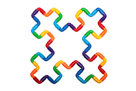 Rainbow colored plastic pipes, bending shapes isolated against white background