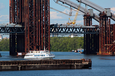 Kyiv, Ukraine - July 16, 2017: Podilsko-Voskresensky Bridge, a combined road-rail bridge over the Dnieper River under construction in Kiev, Ukraineのeditorial素材