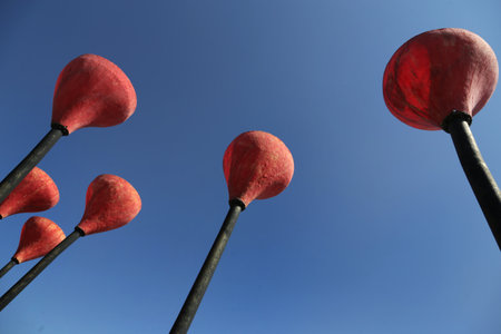 Panske, Ukraine - August 15, 2021: Modern art objects, poppy flower shaped street lights at bus stop with a viewpoint, located on Cherkasy Dam, the longest dam in Ukraine across Dnieper river.のeditorial素材