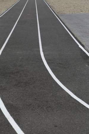 Asphalt racetrack on a stadium, abstract sports background