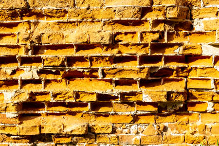 Old vintage red and yellow brick wallの写真素材
