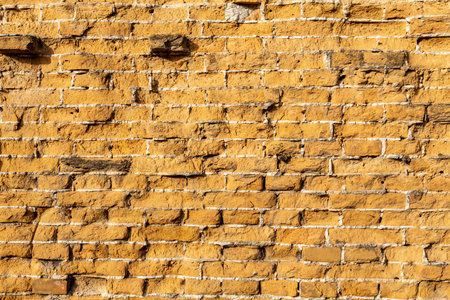 Old vintage red and yellow brick wallの写真素材