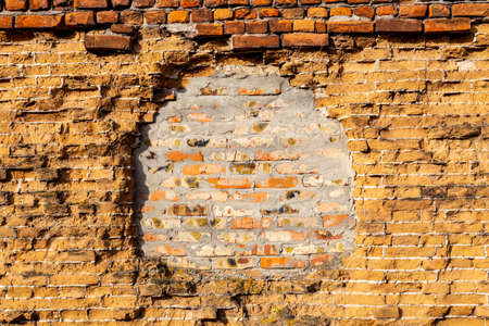 Old vintage red and yellow brick wallの写真素材