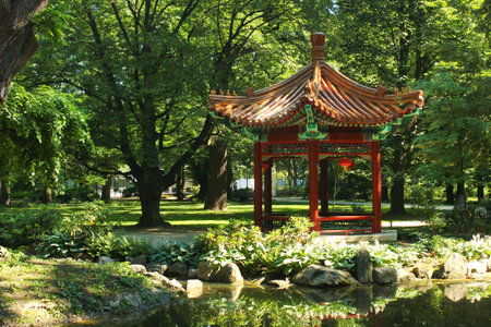 Warsaw, Poland - June 9, 2018: Chinese pavilion with sculptures in Lazienki Park, or Royal Baths, the largest park in Warsaw which occupies 76 hectares of the city center.のeditorial素材