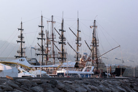 Kemer, Turkey - February 16, 2022: Retro sailing ships in yacht marina of Kemer, a seaside resort...