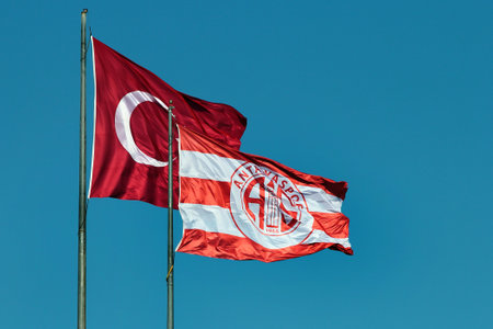 Antalya, Turkey - April 20, 2022: Flags of Turkey and Turkish football club Antalya Spor, based in Antalya Stadium.のeditorial素材