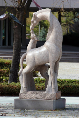 Ankara, Turkey - April 18, 2022: Sculpture of young and old giraffes in front of Ankara Theater, in Youth Park, or Genclik Parki.のeditorial素材