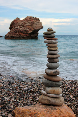 Pebble tower on the seasideの写真素材
