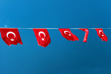 Turkish flags against blue skyの写真素材