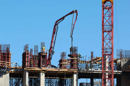 Antalya, Turkey - April 15, 2022: Builders build monolith frame of a shipyard at construction site...