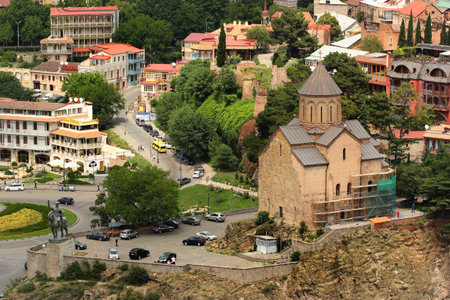 Tbilisi, Georgia - June 19, 2016: Old Metekhi church and historical Avlabari district over Kura...