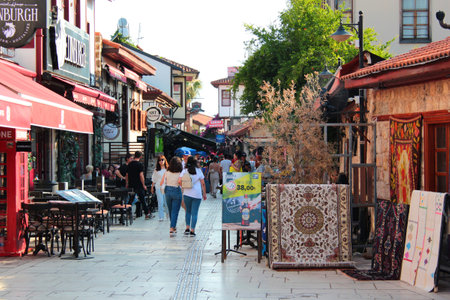 Antalya, Turkey - June 12, 2022: People sit in street cafes in Kaleici the Old Town of Antalya, a popular tourist district in central part of the cityのeditorial素材