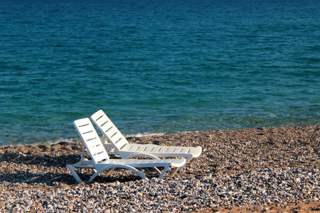 Two beach chairs at the Konyaalti beach in Antalya, Turkeyの写真素材