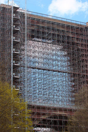 Dense scaffolding on a bridge as a construction background
