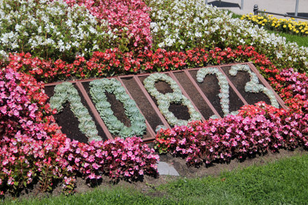 Karlovy Vary, Czech Republic - August 10, 2023: The famous calendar flowerbed in front of Spa No.5 in Smetana orchards shows current date, month and yearのeditorial素材