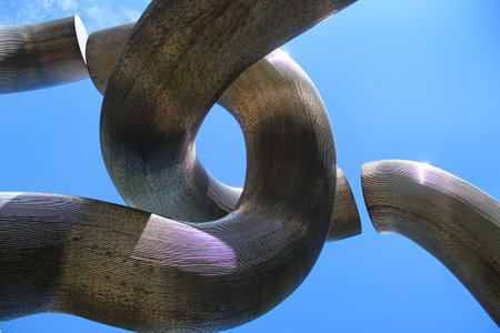 Berlin, Germany - July 8, 2024: Sculpture by Brigitte and Martin Matschinsky-Denninghoff, created for the city's 750th anniversary. Four steel tubes symbolize the division and reunification of Berlin.のeditorial素材