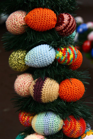 Easter decorations with colorful yarn-wrapped eggs celebrating local lace-making tradition in the Ore Mountains, Germanyの写真素材