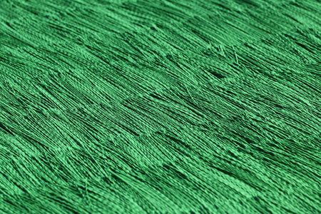 Synthetic green polypropylene matting on summer ski jumping hill for year-round trainingの写真素材